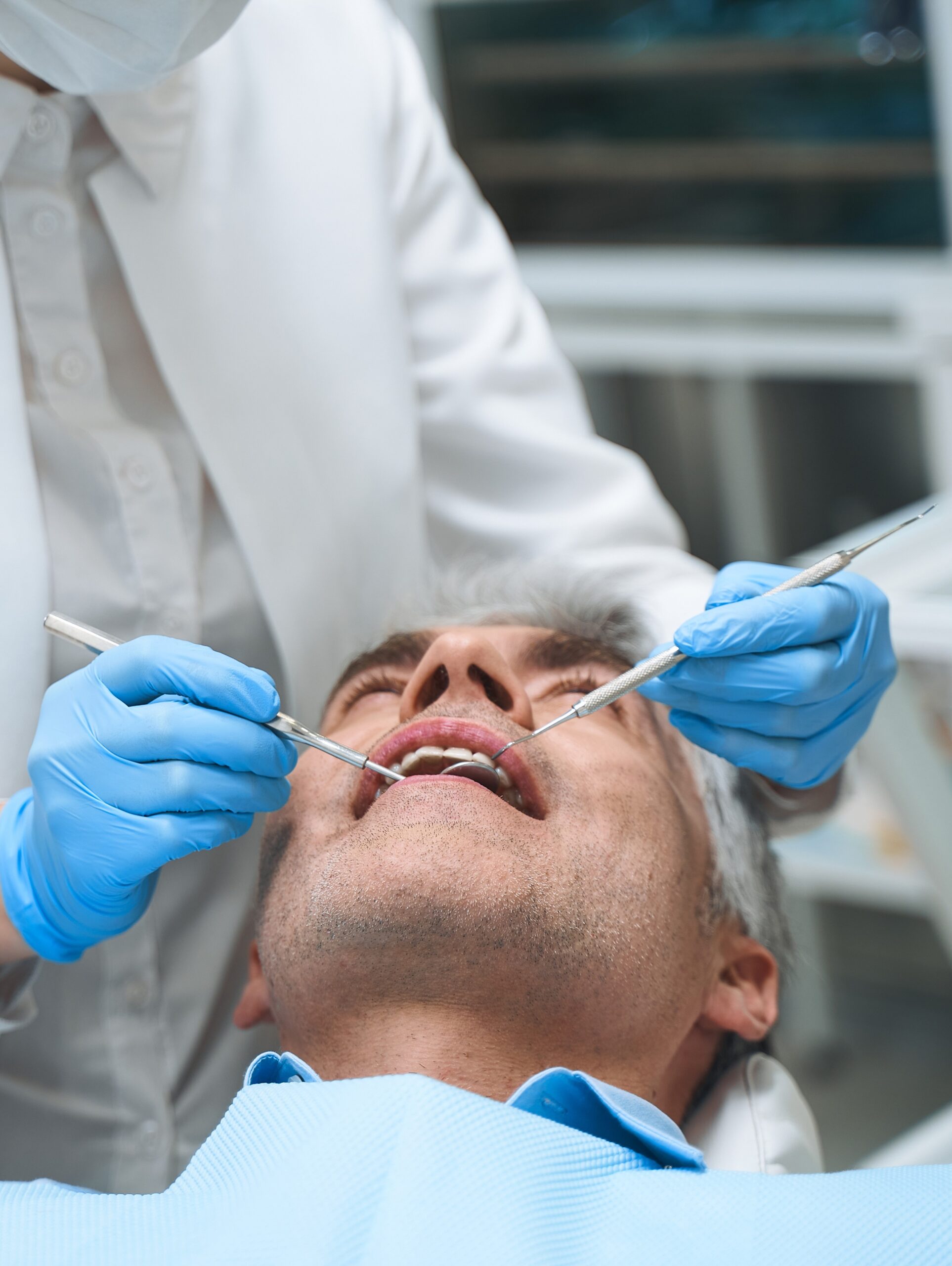 Man visiting dentist for help stock photo