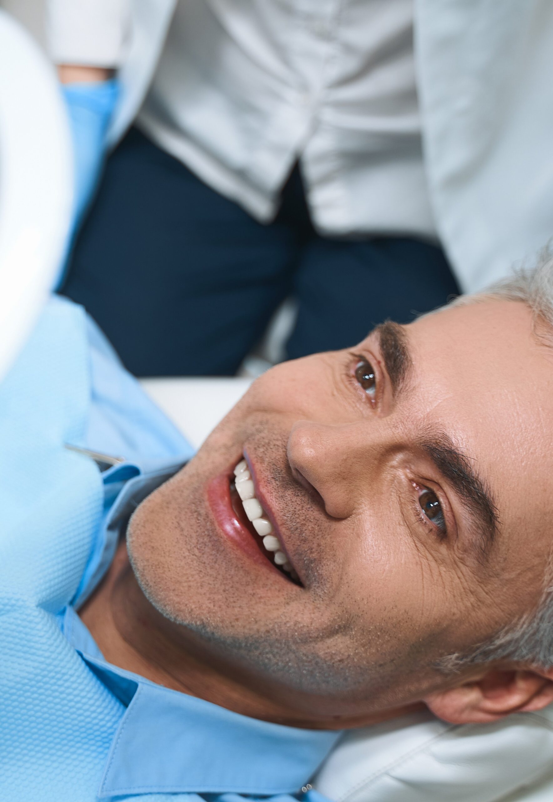 Happy man after dental procedures stock photo